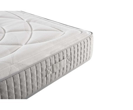 Vista angular del colchón Vissuto Smart con tejido acolchado blanco y lateral gris reforzado