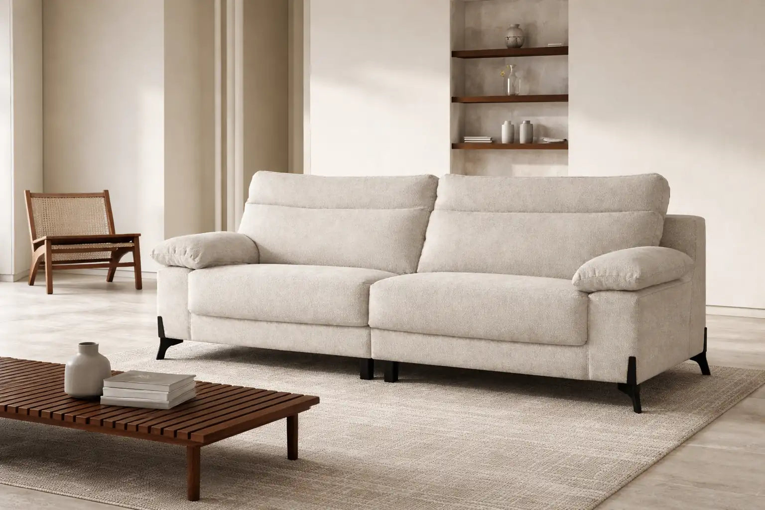 Sofá biplaza en tono beige con patas visibles al exterior en color negro modelo Vissuto Newmeet.