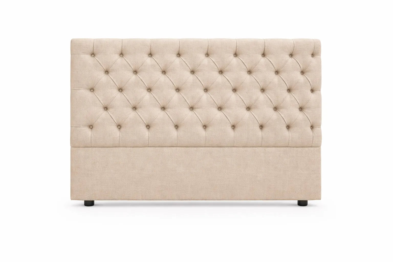 Cabecero capitoné rombos beige con botones forrados.